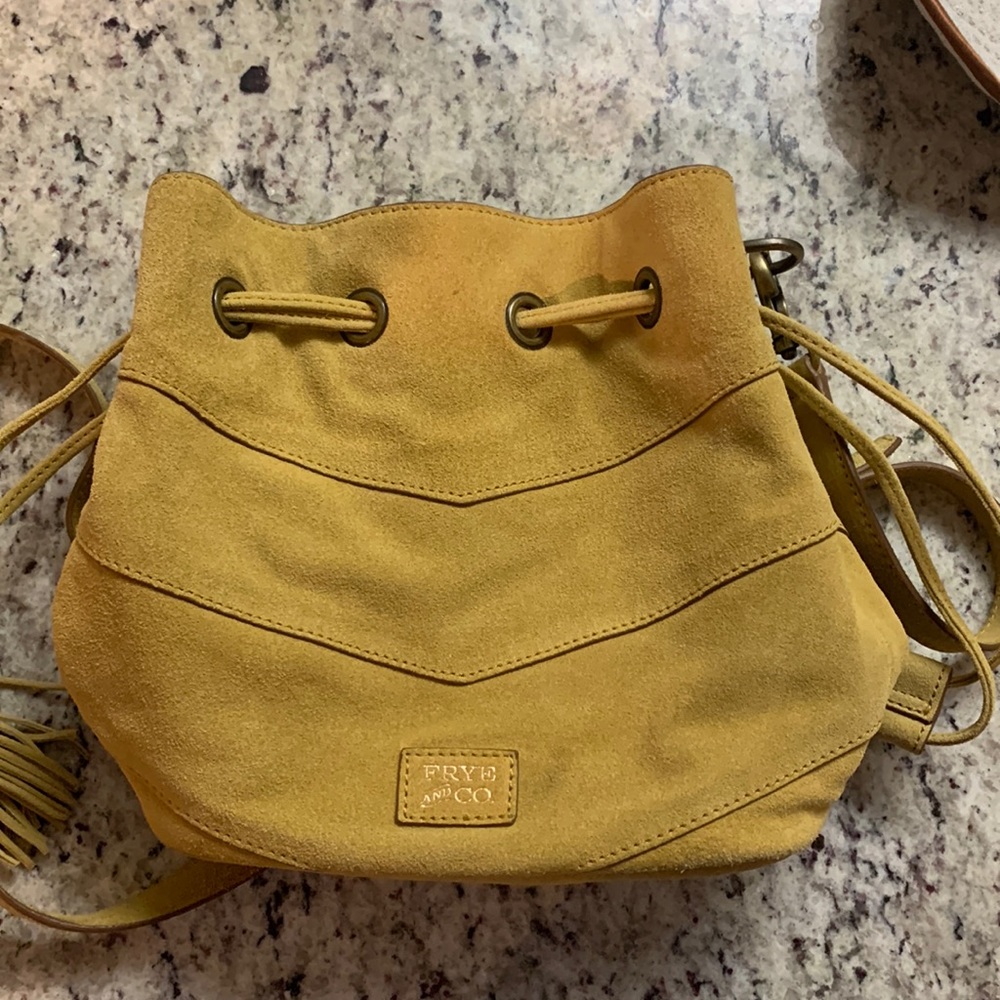 Frye and Co worn only few times suede satchel. Yellow color tassel trim